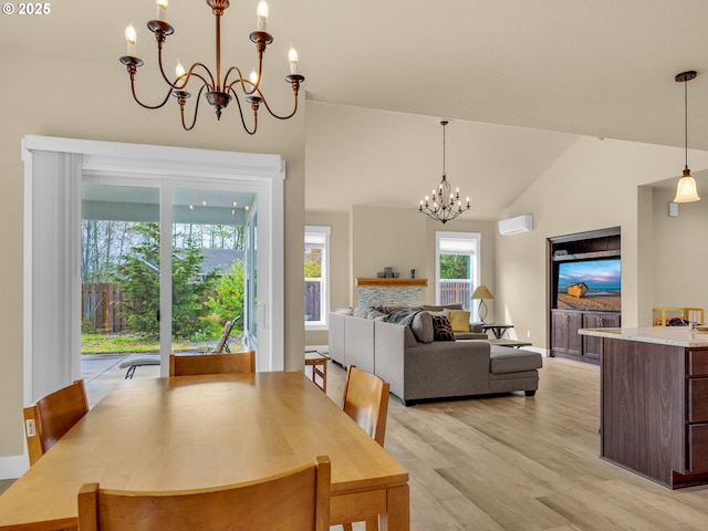 293 W Kershul Cir, Gearhart, OR 97138 - dining room featuring a chandelier, light wood-style floors, and high vaulted ceiling