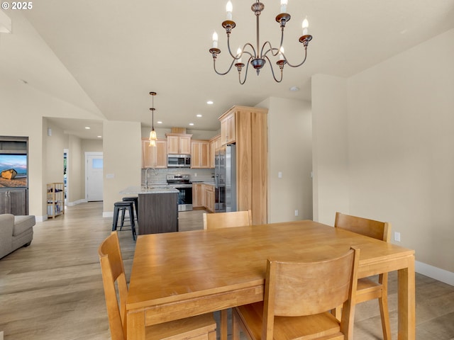 293 W Kershul Cir, Gearhart, OR 97138 - dining room featuring a chandelier, light wood finished floors, and recessed lighting