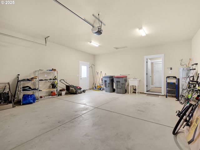 293 W Kershul Cir, Gearhart, OR 97138 - garage with water heater and a garage door opener