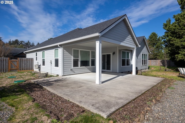 293 W Kershul Cir, Gearhart, OR 97138 - back of property featuring a patio and roof with shingles