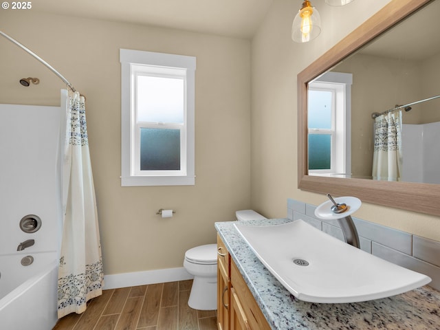 293 W Kershul Cir, Gearhart, OR 97138 - full bathroom with healthy amount of natural light, vanity, shower / tub combo with curtain, and wood finished floors