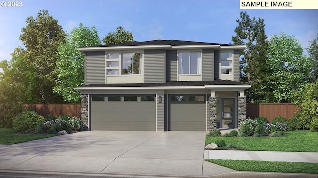 prairie-style house featuring a front yard and a garage