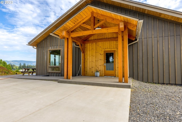 exterior space with a patio area and a mountain view