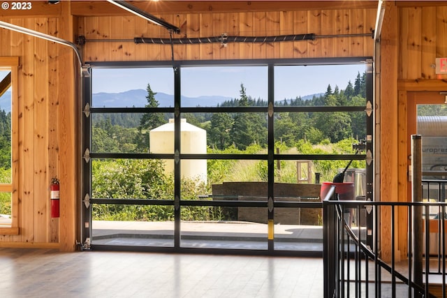 interior space featuring a mountain view and wood walls