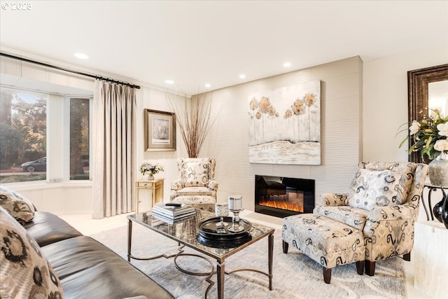 carpeted living room with a large fireplace