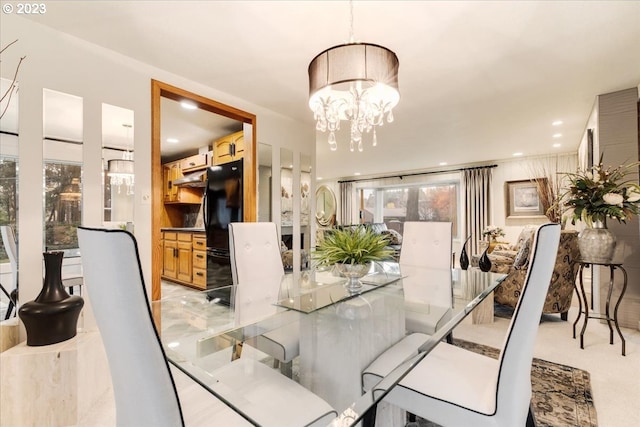 dining space with a chandelier