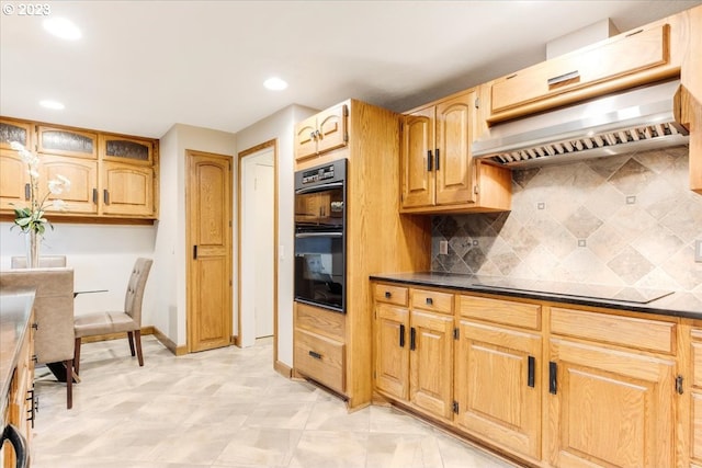 kitchen with backsplash, custom exhaust hood, and black appliances