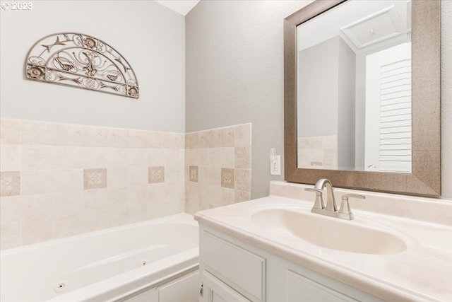 bathroom with vanity and a tub to relax in