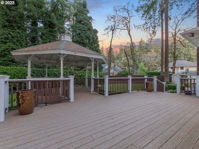 deck at dusk with a gazebo