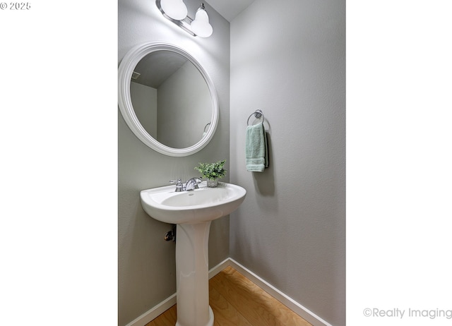 728 NE 72nd Ave, Hillsboro, OR 97124 - bathroom featuring wood finished floors and baseboards