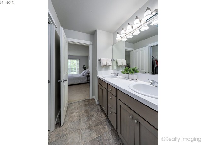 728 NE 72nd Ave, Hillsboro, OR 97124 - full bath with double vanity, connected bathroom, stone finish flooring, and a spacious closet