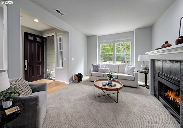728 NE 72nd Ave, Hillsboro, OR 97124 - carpeted living room with a fireplace and baseboards