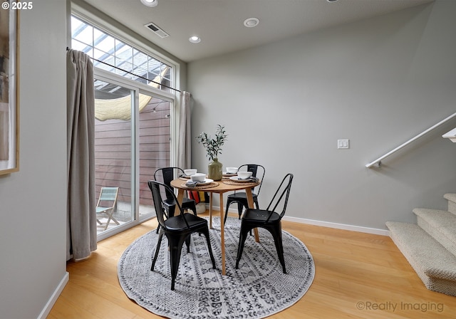 728 NE 72nd Ave, Hillsboro, OR 97124 - dining area featuring stairway, light wood-type flooring, and recessed lighting
