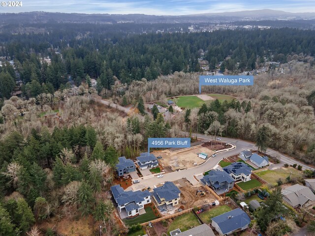 birds eye view of property featuring a mountain view