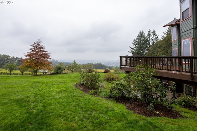 view of yard featuring a wooden deck