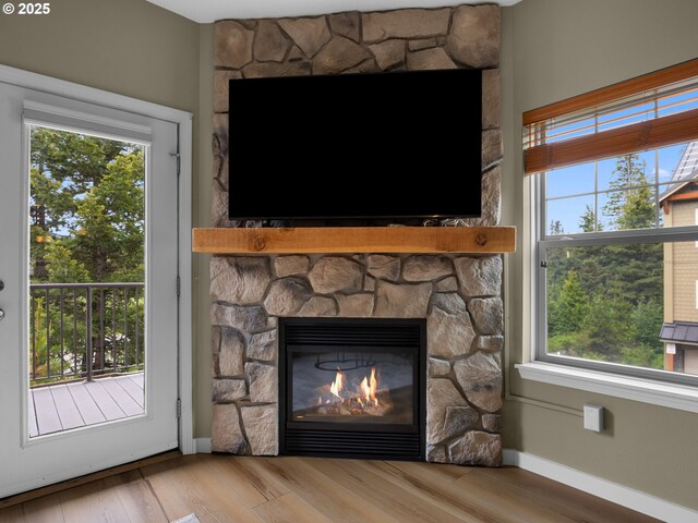 87916 E Alpenglow Ln, Government Camp, OR 97028 - detailed view of a fireplace, baseboards, and wood finished floors