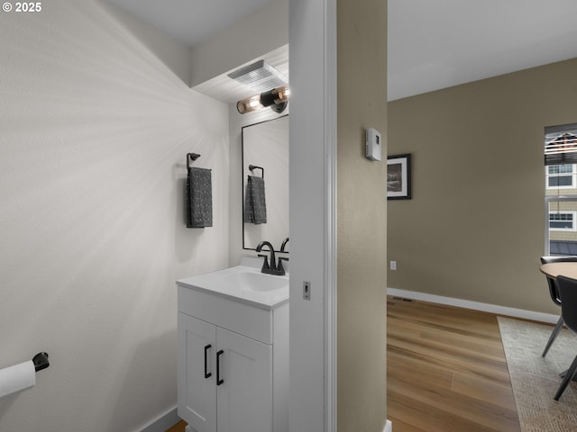 87916 E Alpenglow Ln, Government Camp, OR 97028 - bathroom with vanity, wood finished floors, and baseboards