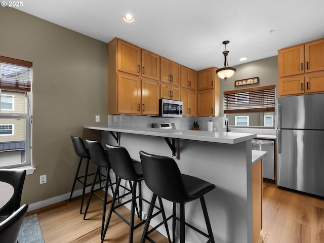 87916 E Alpenglow Ln, Government Camp, OR 97028 - kitchen featuring stainless steel appliances, plenty of natural light, light wood finished floors, and recessed lighting