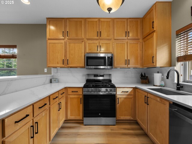 87916 E Alpenglow Ln, Government Camp, OR 97028 - kitchen with appliances with stainless steel finishes, a sink, plenty of natural light, light wood-style floors, and recessed lighting