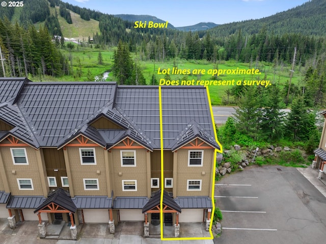 87916 E Alpenglow Ln, Government Camp, OR 97028 - aerial view of property's location with mountains, a heavily wooded area, and property boundaries highlighted