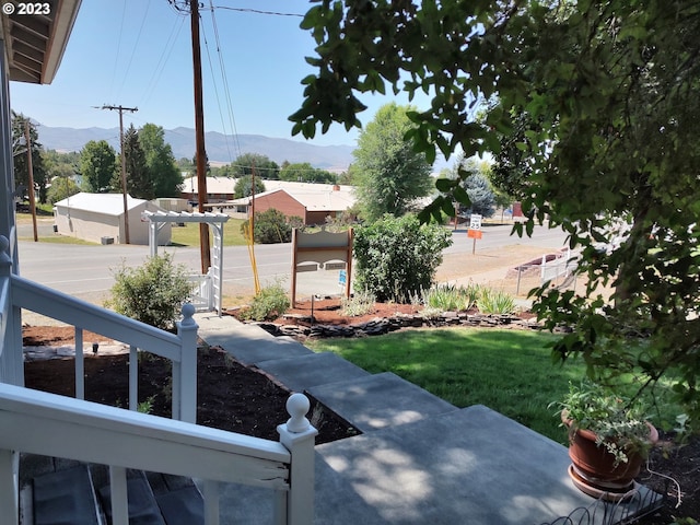 206 NE Front St, Prairie City, OR 97869 - view of yard with a mountain view and a pergola