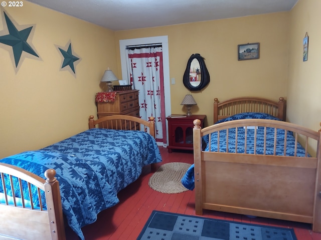 206 NE Front St, Prairie City, OR 97869 - bedroom with dark wood-type flooring