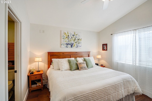 bedroom with lofted ceiling, a ceiling fan, and dark wood-style flooring