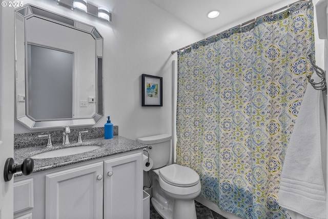 bathroom featuring vanity, toilet, and a shower with curtain
