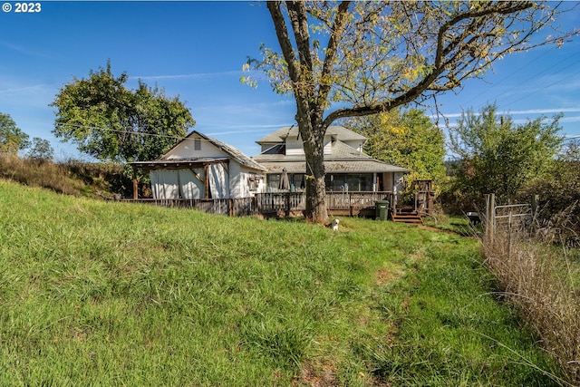 view of yard featuring a wooden deck