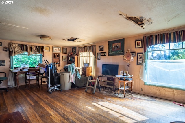 interior space with a textured ceiling and dark wood-type flooring