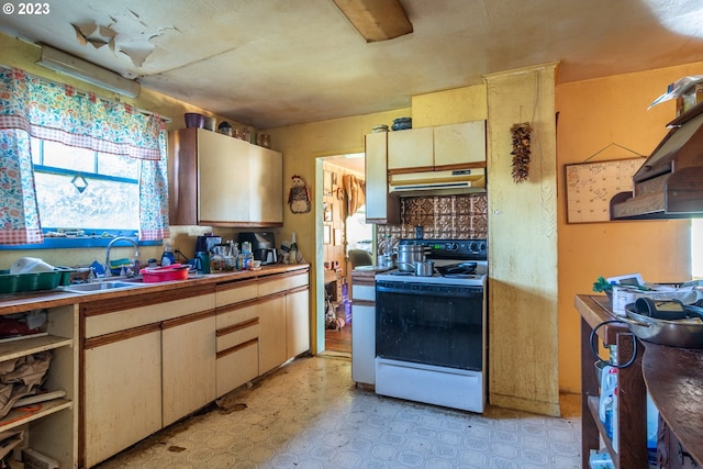 kitchen featuring white electric range, sink, and light tile floors