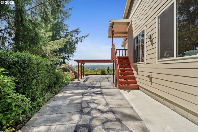 38225 Hiagua Ln N, Nehalem, OR 97131 - view of patio / terrace with stairs and concrete driveway