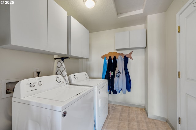 38225 Hiagua Ln N, Nehalem, OR 97131 - laundry room with cabinet space, separate washer and dryer, attic access, and light flooring