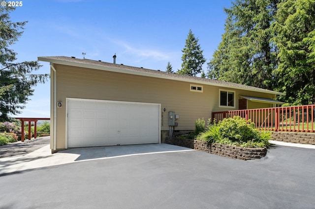 38225 Hiagua Ln N, Nehalem, OR 97131 - view of front of home with asphalt driveway and a garage