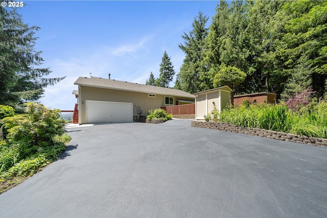 38225 Hiagua Ln N, Nehalem, OR 97131 - ranch-style house with an attached garage and driveway