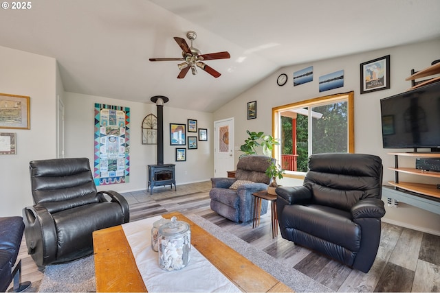 38225 Hiagua Ln N, Nehalem, OR 97131 - living room with ceiling fan, wood finished floors, lofted ceiling, and a wood stove