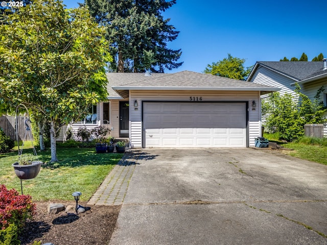 ranch-style home featuring concrete driveway, a garage, a front lawn, and a shingled roof