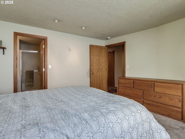 carpeted bedroom with a textured ceiling