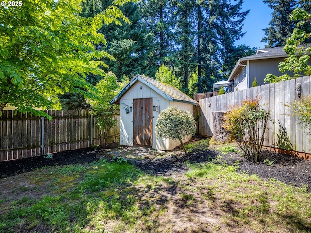 view of shed featuring a fenced backyard