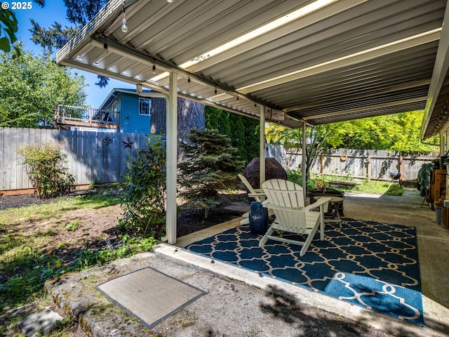 view of patio / terrace featuring fence