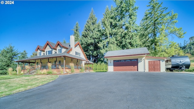 view of front of property with a porch and a front lawn