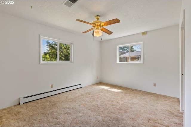 2107 Cove Ave, La Grande, OR 97850 - carpeted spare room with baseboard heating and a ceiling fan