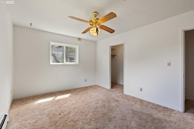 2107 Cove Ave, La Grande, OR 97850 - unfurnished bedroom with carpet, a spacious closet, a baseboard radiator, and a closet