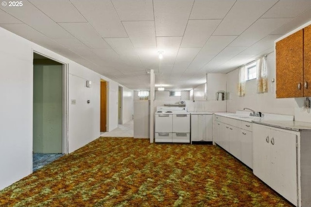 2107 Cove Ave, La Grande, OR 97850 - kitchen featuring washer / clothes dryer, dark carpet, white cabinets, and light countertops