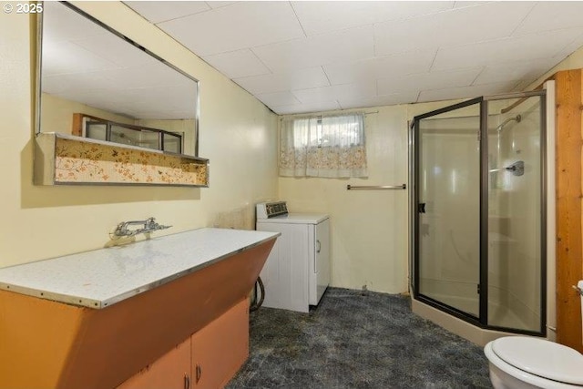 2107 Cove Ave, La Grande, OR 97850 - bathroom with washer / clothes dryer, a shower stall, and vanity