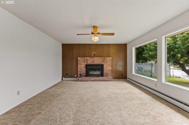 2107 Cove Ave, La Grande, OR 97850 - unfurnished living room with a baseboard heating unit, wooden walls, an accent wall, carpet floors, and ceiling fan
