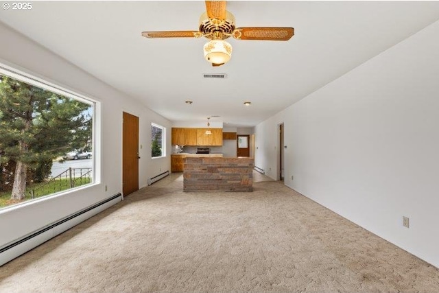 2107 Cove Ave, La Grande, OR 97850 - unfurnished living room with baseboard heating, a baseboard radiator, and light carpet