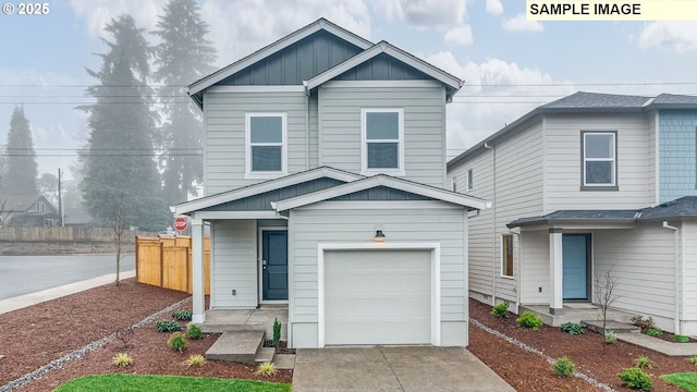 5506 NE 66th Pl, Vancouver, WA 98661 - traditional home featuring concrete driveway, board and batten siding, fence, and an attached garage