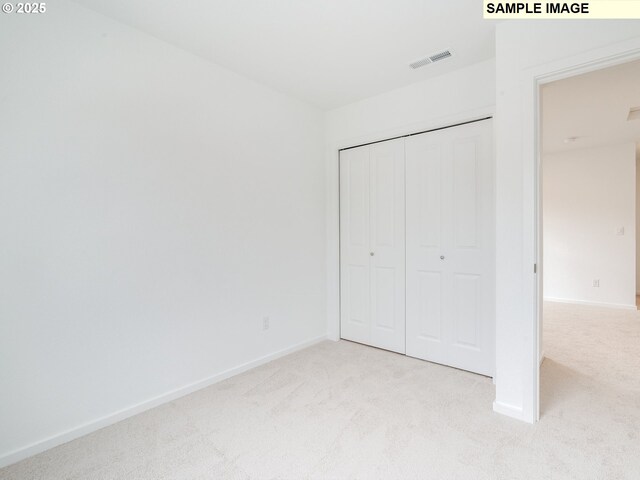 5506 NE 66th Pl, Vancouver, WA 98661 - unfurnished bedroom featuring a closet, visible vents, baseboards, and light carpet