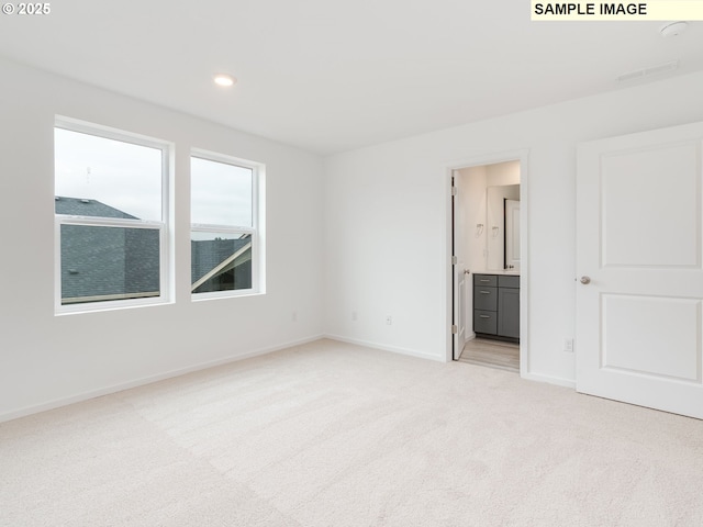 5506 NE 66th Pl, Vancouver, WA 98661 - interior space featuring light colored carpet, connected bathroom, baseboards, and recessed lighting